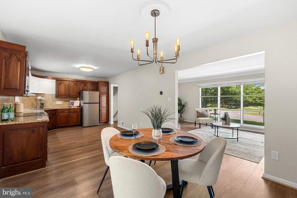 Chandelier, Dining room, Interior, Kitchen, Pendant Lights, Stainless Steel Appliances, Wood Texture Flooring