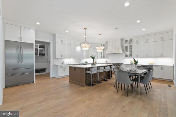 Chandelier, Dining room, Interior, Kitchen, Pendant Lights, Recessed Lighting, Stainless Steel Appliances, Wood Texture Flooring