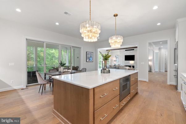 Chandelier, Dining room, Interior, Kitchen, Pendant Lights, Recessed Lighting, Stainless Steel Appliances, Wood Texture Flooring