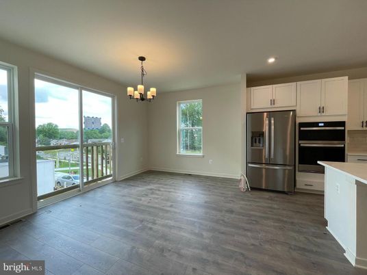 Chandelier, Empty room, Interior, Kitchen, Recessed Lighting, Stainless Steel Appliances, Wood Texture Flooring