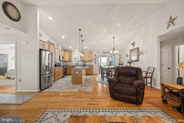 Chandelier, Dining room, Interior, Kitchen, Pendant Lights, Recessed Lighting, Stainless Steel Appliances, Wood Texture Flooring
