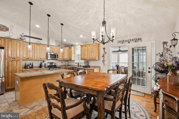 Chandelier, Dining room, Interior, Kitchen, Pendant Lights, Recessed Lighting, Stainless Steel Appliances, Wood Texture Flooring