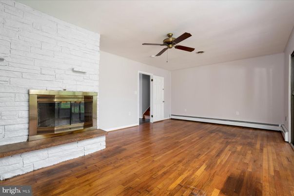 Empty room, Fireplace, Interior, Stone Walls, Wood Texture Flooring