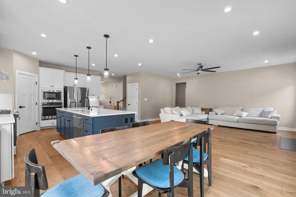 Dining room, Interior, Kitchen, Living room, Pendant Lights, Recessed Lighting, Stainless Steel Appliances, Wood Texture Flooring