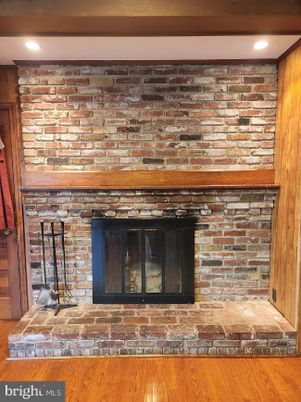 Fireplace, Interior, Recessed Lighting, Stone Walls, Wood Texture Flooring