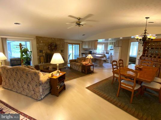 Chandelier, Dining room, Interior, Kitchen, Living room, Pendant Lights, Recessed Lighting, Stone Walls, Wood Texture Flooring