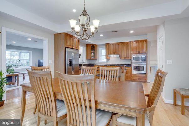 Chandelier, Dining room, Interior, Kitchen, Recessed Lighting, Stainless Steel Appliances, Wood Texture Flooring
