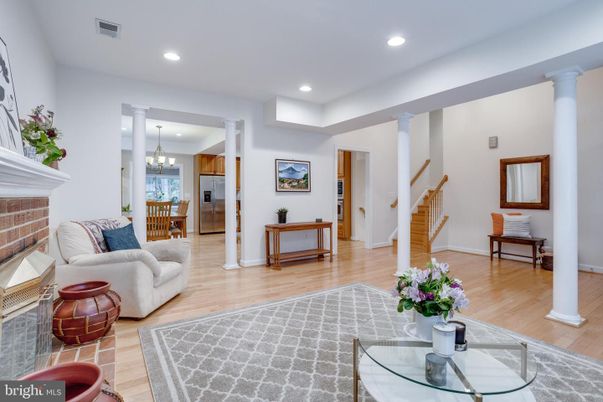 Chandelier, Fireplace, Interior, Living room, Recessed Lighting, Stainless Steel Appliances, Wood Texture Flooring