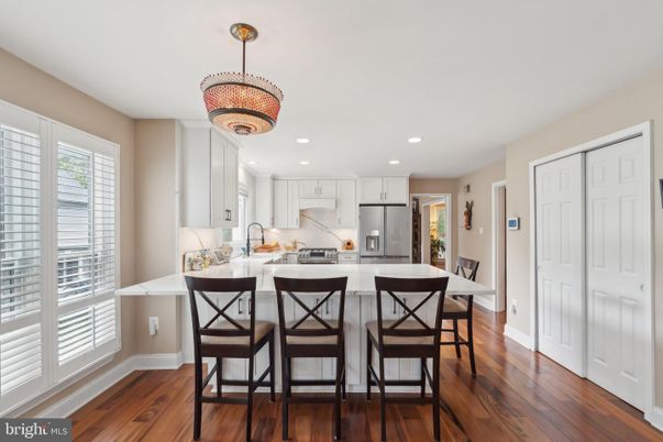 Chandelier, Dining room, Interior, Kitchen, Recessed Lighting, Stainless Steel Appliances, Wood Texture Flooring