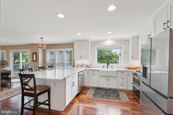 Dining room, Interior, Kitchen, Pendant Lights, Recessed Lighting, Stainless Steel Appliances, Wood Texture Flooring