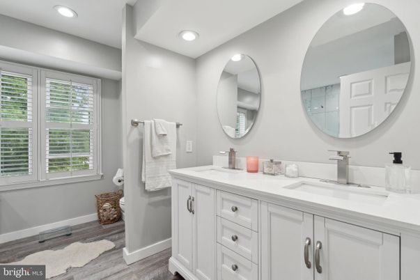 Bathroom, Dual Sink Vanities, Interior, Recessed Lighting, Wood Texture Flooring