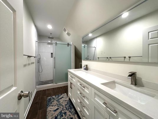 Bathroom, Dual Sink Vanities, Glass Shower, Interior, Recessed Lighting, Wood Texture Flooring