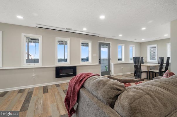 Dining room, Fireplace, Interior, Living room, Recessed Lighting, Wood Texture Flooring