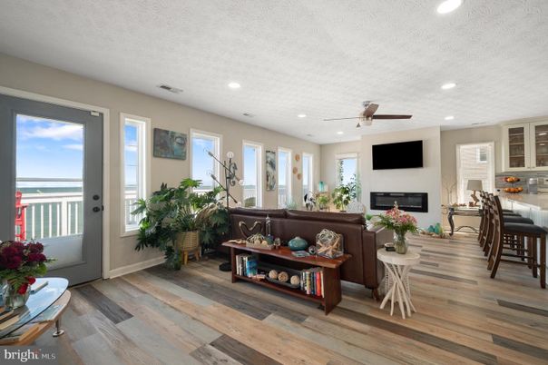 Fireplace, Interior, Living room, Recessed Lighting, Water, Wood Texture Flooring