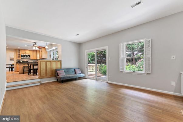 Empty room, Interior, Kitchen, Recessed Lighting, Stainless Steel Appliances, Wood Texture Flooring