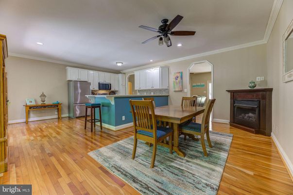 Dining room, Fireplace, Interior, Kitchen, Recessed Lighting, Wood Texture Flooring