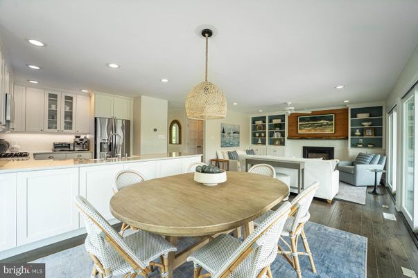 Dining room, Fireplace, Interior, Kitchen, Living room, Pendant Lights, Recessed Lighting, Stainless Steel Appliances, Wood Texture Flooring
