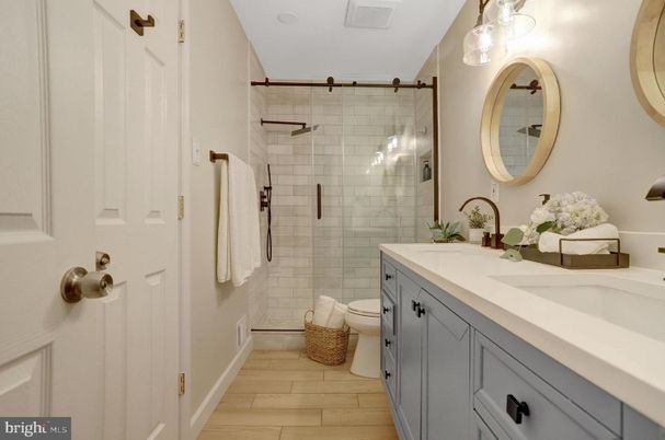 Bathroom, Dual Sink Vanities, Glass Shower, Interior, Wood Texture Flooring