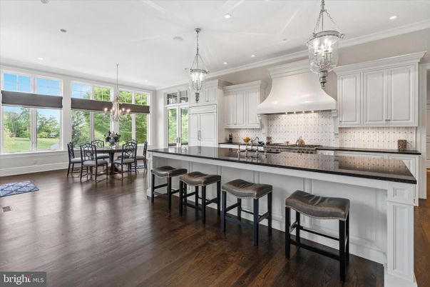 Chandelier, Dining room, Interior, Kitchen, Pendant Lights, Recessed Lighting, Stainless Steel Appliances, Wood Texture Flooring