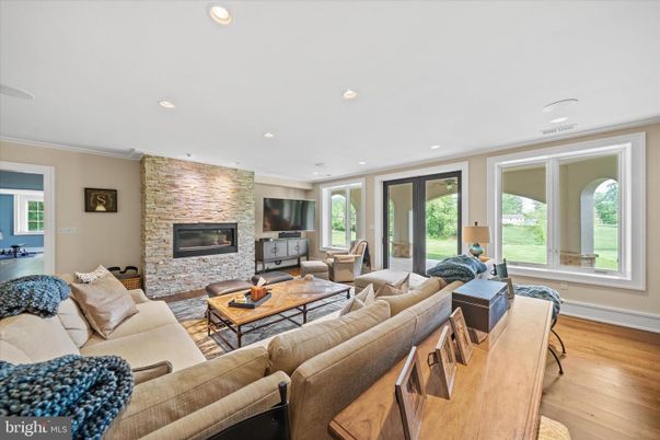 Fireplace, Interior, Living room, Recessed Lighting, Stone Walls, Wood Texture Flooring