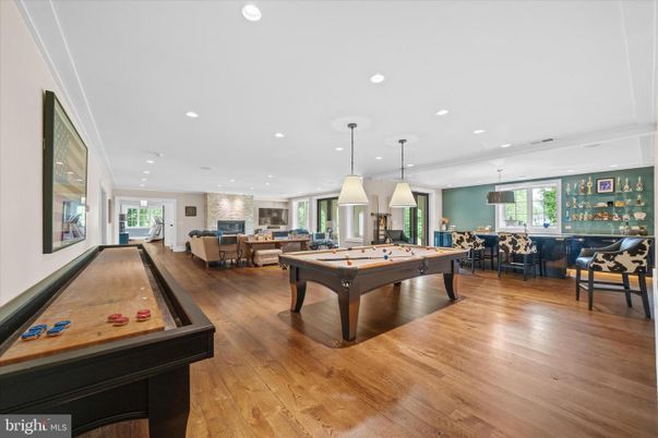 Billiard Table, Dining room, Fireplace, Game Room, Interior, Living room, Pendant Lights, Recessed Lighting, Wood Texture Flooring