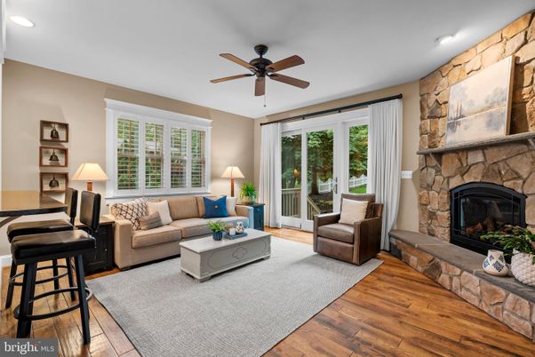 Fireplace, Interior, Living room, Recessed Lighting, Stone Walls, Wood Texture Flooring