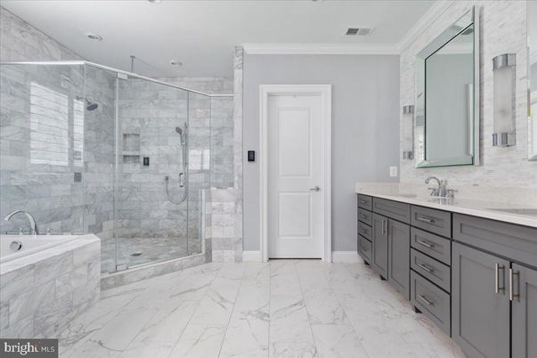 Bathroom, Dual Sink Vanities, Glass Shower, Interior, Marble, Marble Walls, Recessed Lighting