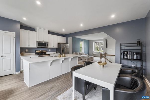 Dining room, Interior, Kitchen, Living room, Recessed Lighting, Stainless Steel Appliances, Wood Texture Flooring