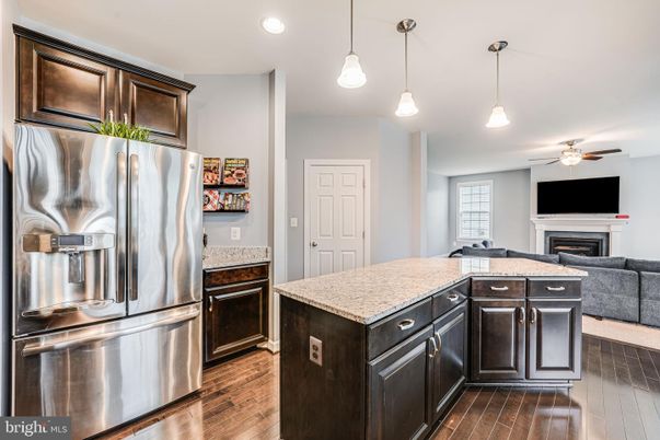 Fireplace, Interior, Kitchen, Pendant Lights, Recessed Lighting, Stainless Steel Appliances, Wood Texture Flooring