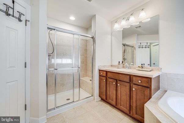 Bathroom, Dual Sink Vanities, Glass Shower, Interior, Recessed Lighting, Tile Countertops