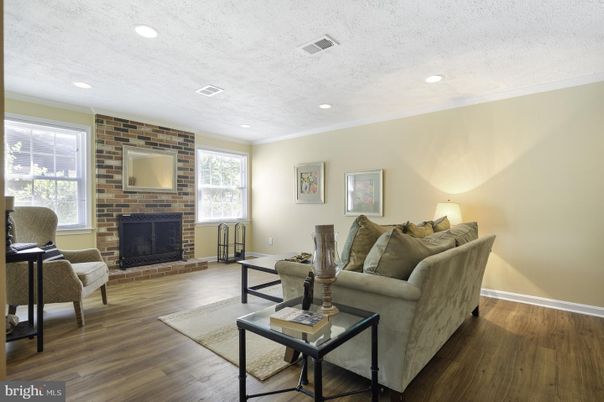 Fireplace, Interior, Living room, Recessed Lighting, Stone Walls, Wood Texture Flooring