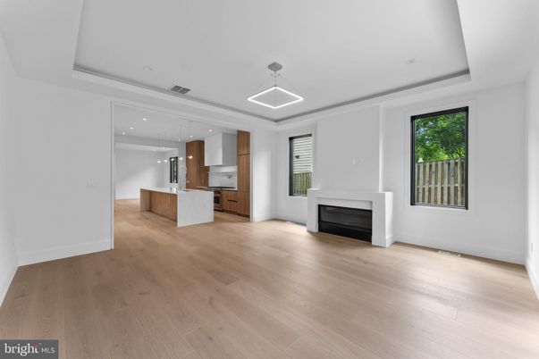 Empty room, Fireplace, Interior, Kitchen, Pendant Lights, Recessed Lighting, Wood Texture Flooring