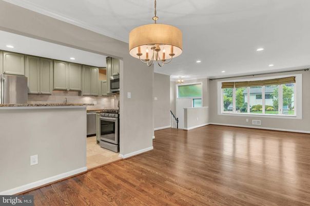 Chandelier, Empty room, Interior, Kitchen, Recessed Lighting, Stainless Steel Appliances, Wood Texture Flooring