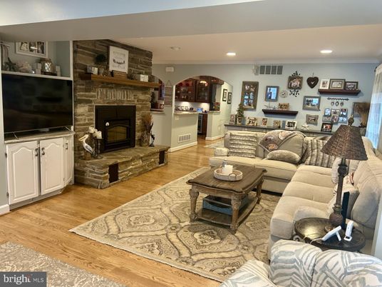 Fireplace, Interior, Living room, Recessed Lighting, Stone Walls, Wood Texture Flooring