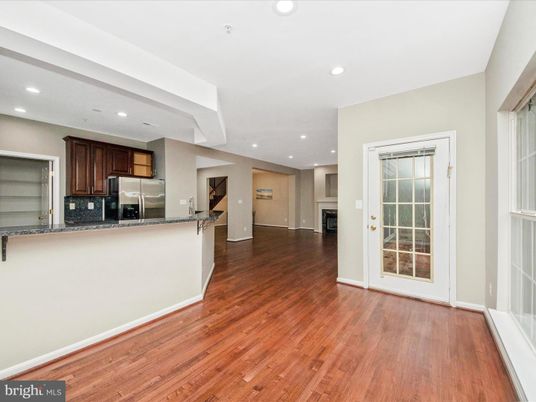 Empty room, Interior, Kitchen, Recessed Lighting, Stainless Steel Appliances, Wood Texture Flooring