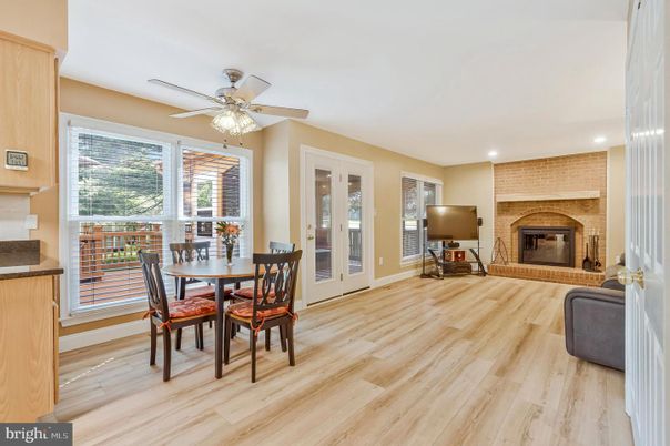 Dining room, Fireplace, Interior, Recessed Lighting, Stone Walls, Wood Texture Flooring