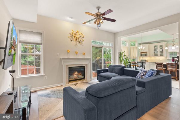 Chandelier, Dining room, Fireplace, Interior, Living room, Pendant Lights, Recessed Lighting, Wood Texture Flooring