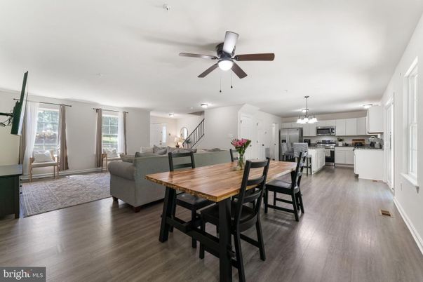Chandelier, Dining room, Interior, Kitchen, Living room, Stainless Steel Appliances, Wood Texture Flooring