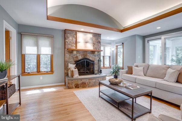 Fireplace, Interior, Living room, Recessed Lighting, Stone Walls, Wood Texture Flooring