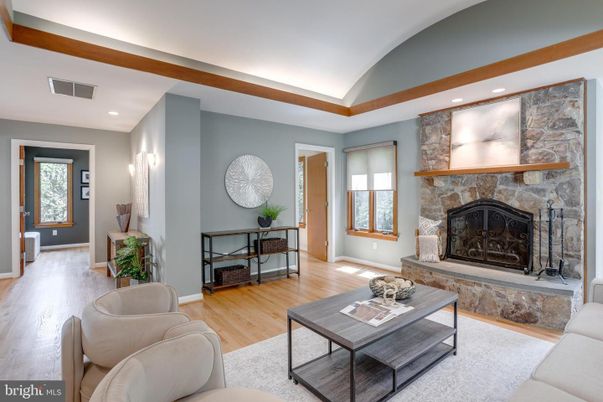 Fireplace, Interior, Living room, Recessed Lighting, Stone Walls, Wood Texture Flooring