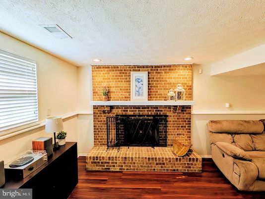 Fireplace, Interior, Recessed Lighting, Stone Walls, Wood Texture Flooring