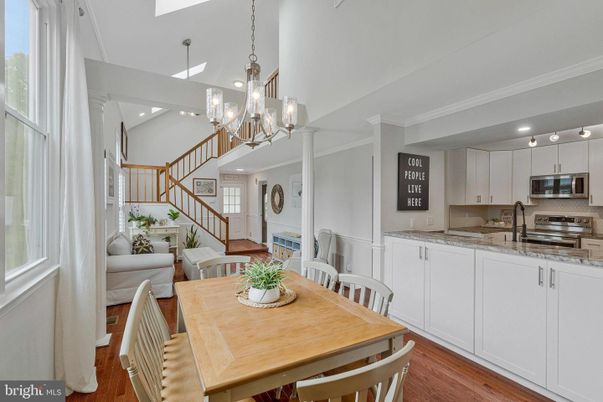 Chandelier, Dining room, Interior, Kitchen, Pendant Lights, Recessed Lighting, Stainless Steel Appliances, Wood Texture Flooring