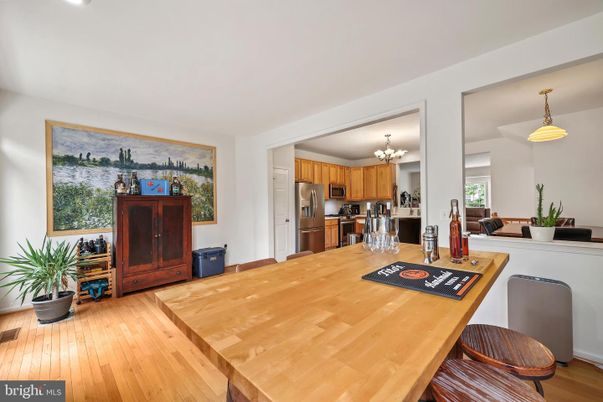 Chandelier, Dining room, Interior, Kitchen, Stainless Steel Appliances, Wood Texture Flooring