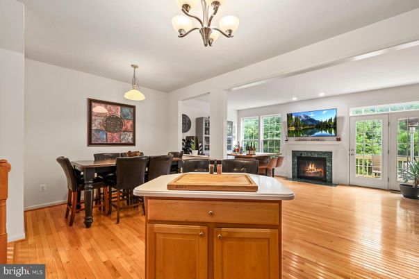 Chandelier, Dining room, Fireplace, Interior, Pendant Lights, Recessed Lighting, Wood Texture Flooring