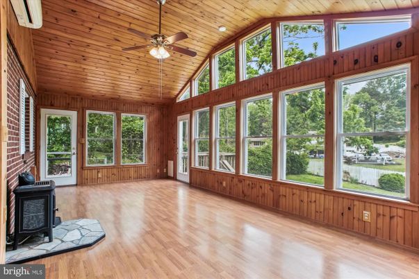 Empty room, Fireplace, Interior, Stone Walls, Sun Room, Wooden Ceilings, Wood Texture Flooring, Wooden Walls