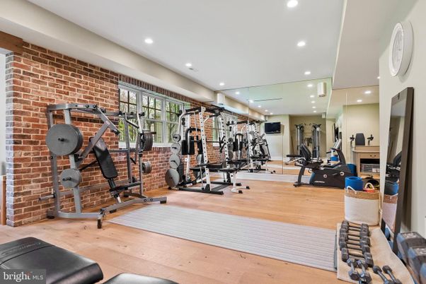 Fitness Equipment, Gym, Interior, Recessed Lighting, Stone Walls, Wood Texture Flooring