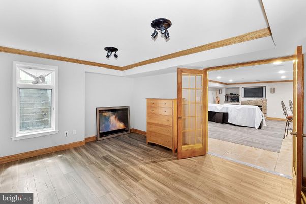 Bedroom, Fireplace, Interior, Recessed Lighting, Wood Texture Flooring