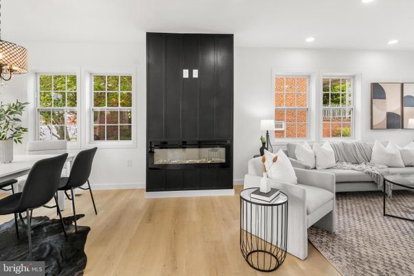 Dining room, Fireplace, Interior, Living room, Recessed Lighting, Wood Texture Flooring