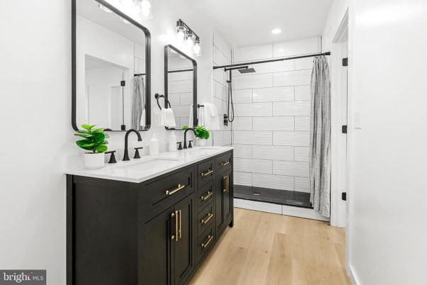 Bathroom, Dual Sink Vanities, Glass Shower, Interior, Recessed Lighting, Wood Texture Flooring