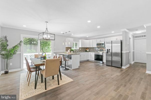 Dining room, Interior, Kitchen, Pendant Lights, Recessed Lighting, Stainless Steel Appliances, Wood Texture Flooring